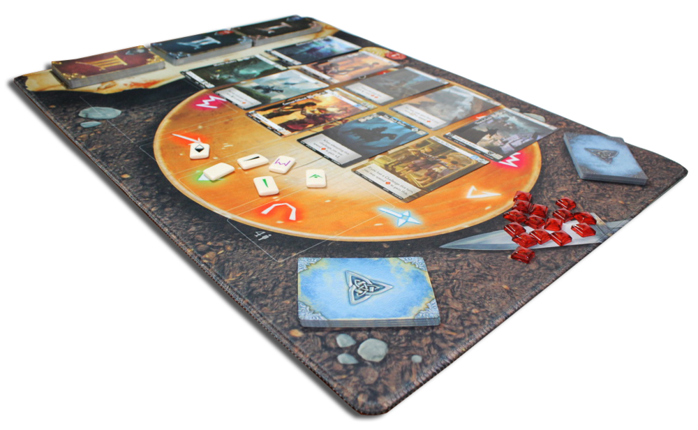 A fantasy board game set up on a brown playmat, featuring a circular orange play area, many cards, white rune-like tokens, and red gems