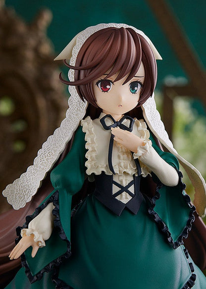 Detailed anime figure of a girl in a dark green Victorian-style dress with white lace trim and a corset