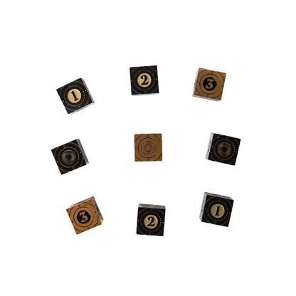 Nine black and bronze cubes showing gold and black numbers 1, 2, 3, and circular patterns, arranged in a circle
