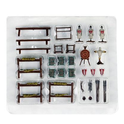 A packaged miniature fantasy barracks/camp set: bunk beds, knight figures, weapons, targets, and doors, in clear plastic