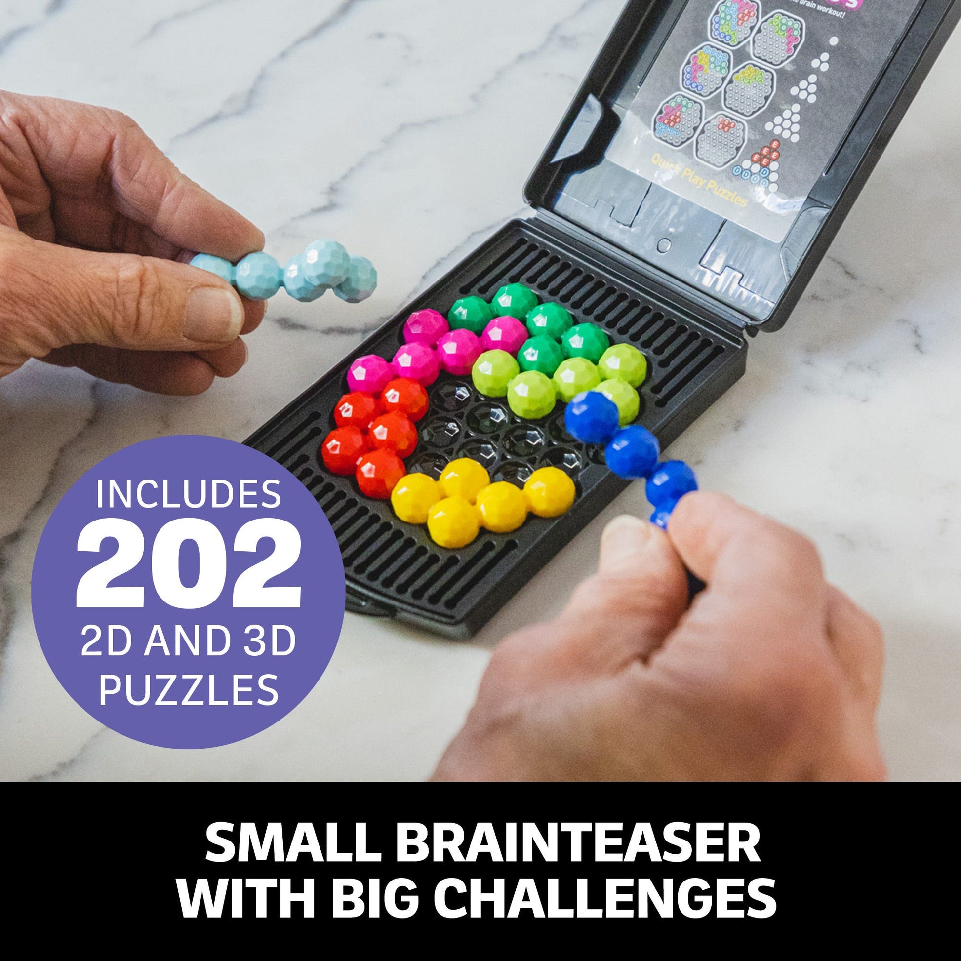 Hands place colourful, faceted bead puzzle pieces into the black hexagonal game board