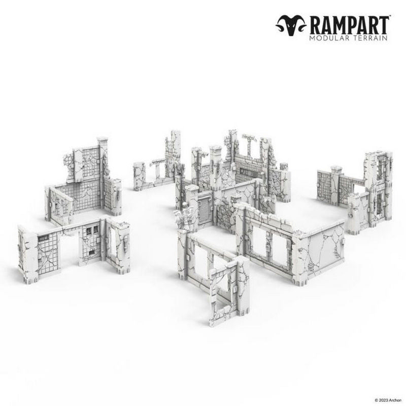 White modular terrain pieces depicting various crumbled, ruined building walls and structures