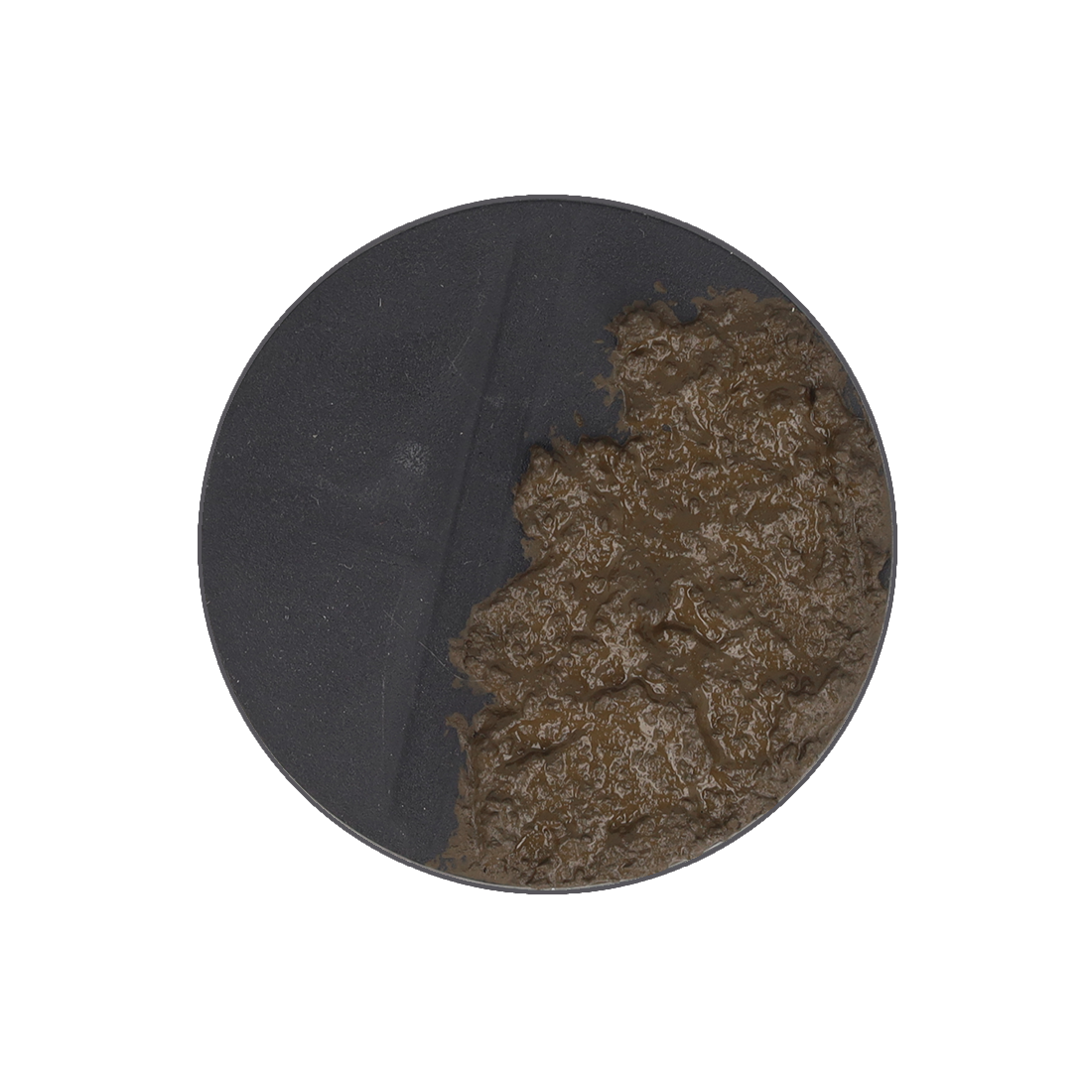 A dark gray circular base half-covered in thick, lumpy brown mud.