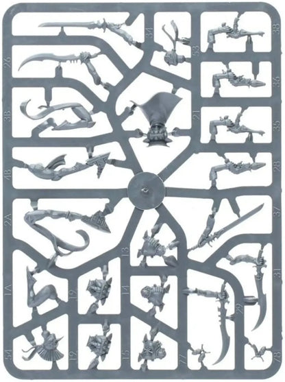 Gray plastic sprue of unassembled miniature model parts, including weapons, heads and limbs