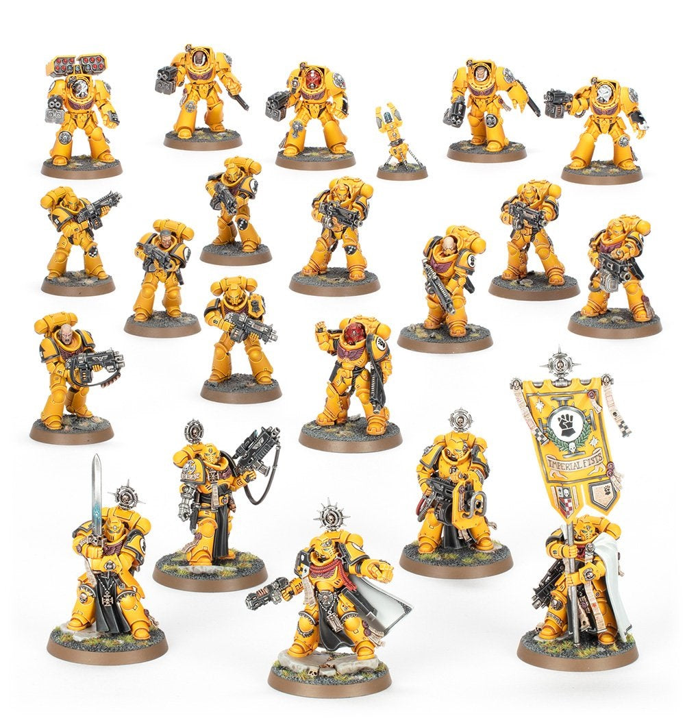 A large squad of yellow Space Marine miniatures (Imperial Fists) in power and Terminator armor