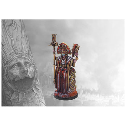 Ornate painted miniature figure in red and gold robes, holding a staff and ritual object, standing beside a carved stone pillar
