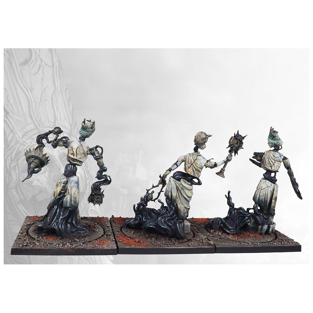 Three painted wargame miniatures: cracked white figures dissolving into black smoke, holding spiked weapons