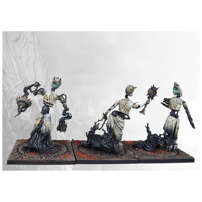 Three painted wargame miniatures: cracked white figures dissolving into black smoke, holding spiked weapons
