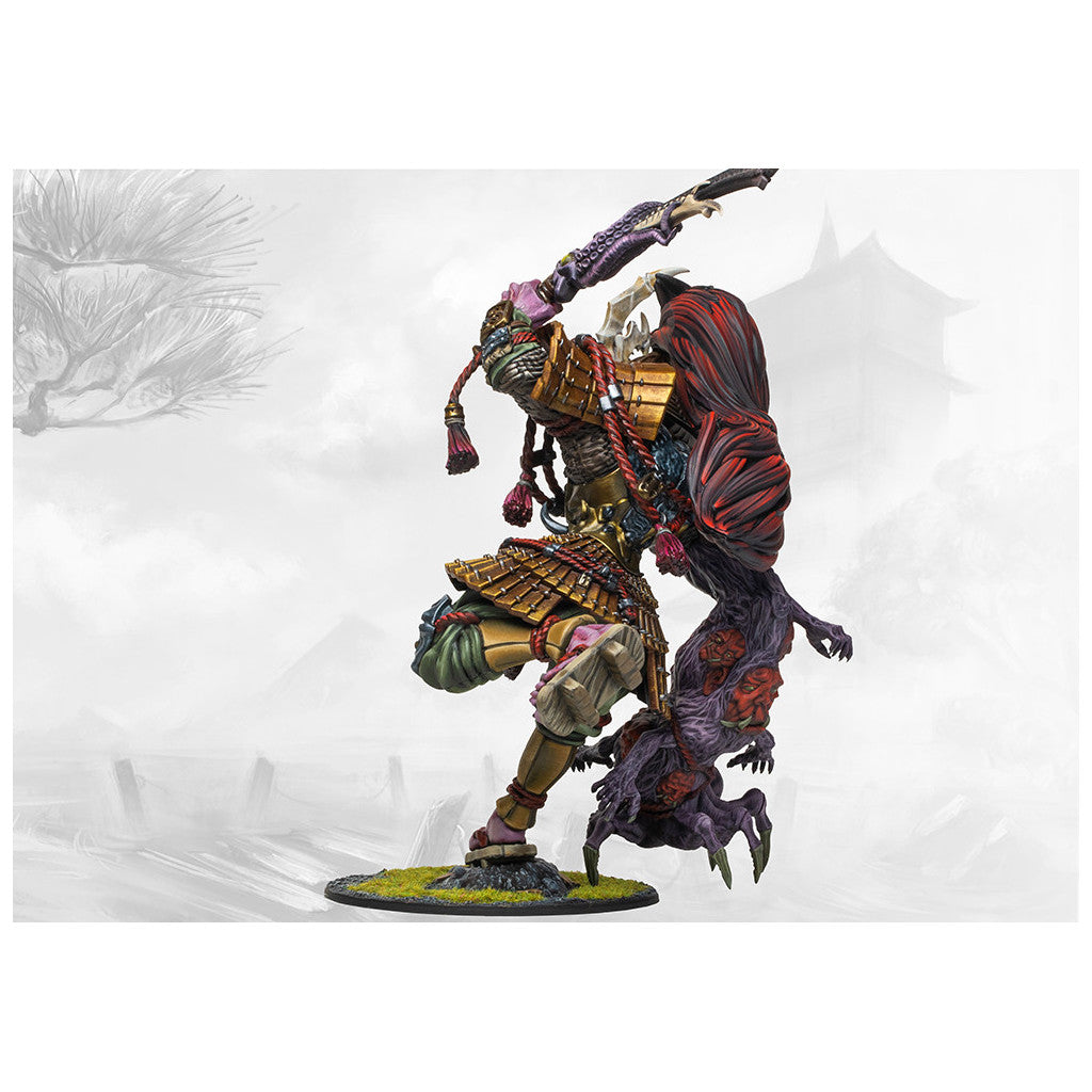 Hand-painted miniature of a gold-armored warrior mid-strike, joined with a large, grotesque purple demon on its back