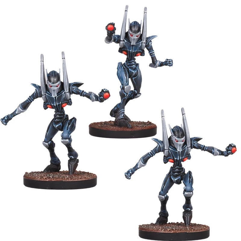 Three dark blue robot miniatures with red eyes and back antennas, holding glowing red orbs
