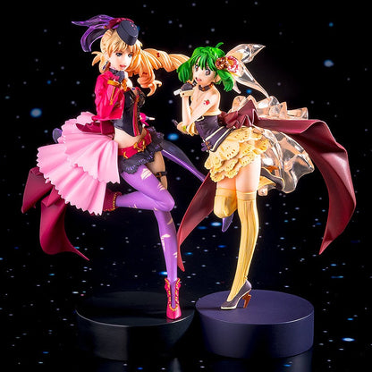 Colorful anime figures of two female idols in dynamic poses with detailed costumes and flowing elements