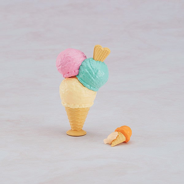 Pink-haired Nendoroid figure posed with included shop parts