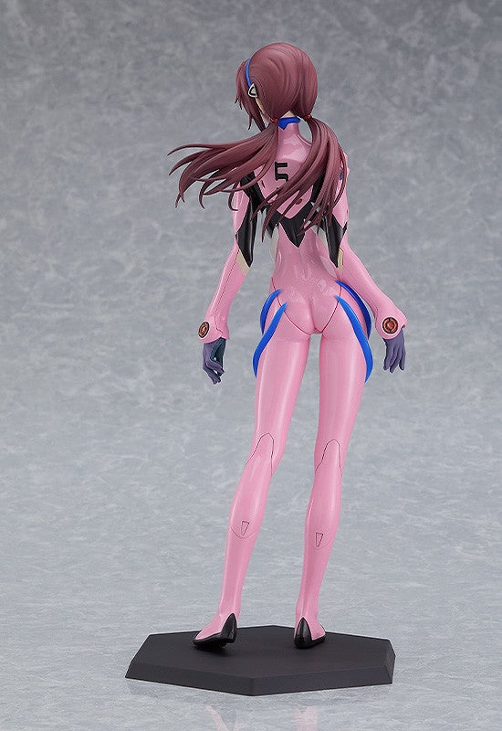 Pink-suited anime figure with long flowing hair and '5' on her back, viewed from behind, standing on a base