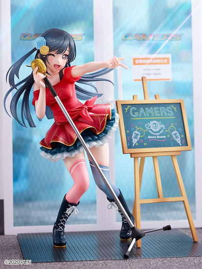 Vibrant anime figurine of a winking girl in a red idol outfit, holding a gold mic, posing by a Gamers store display.