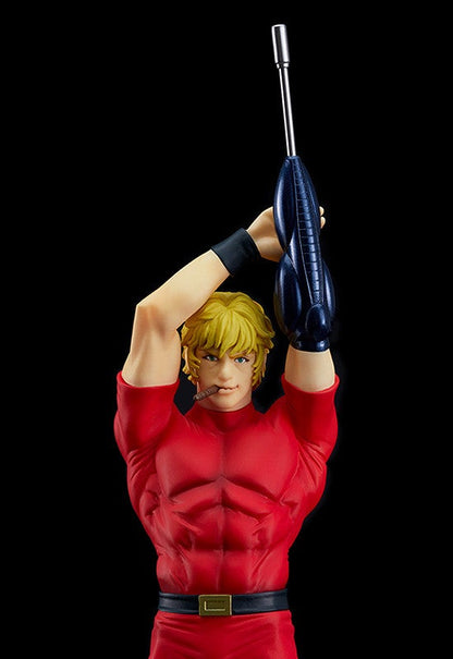Anime action figure of Cobra in a red outfit holding a blue laser rifle above his head