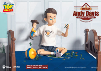 Andy Davis action figure holding Woody and a green army man on a bed with stars