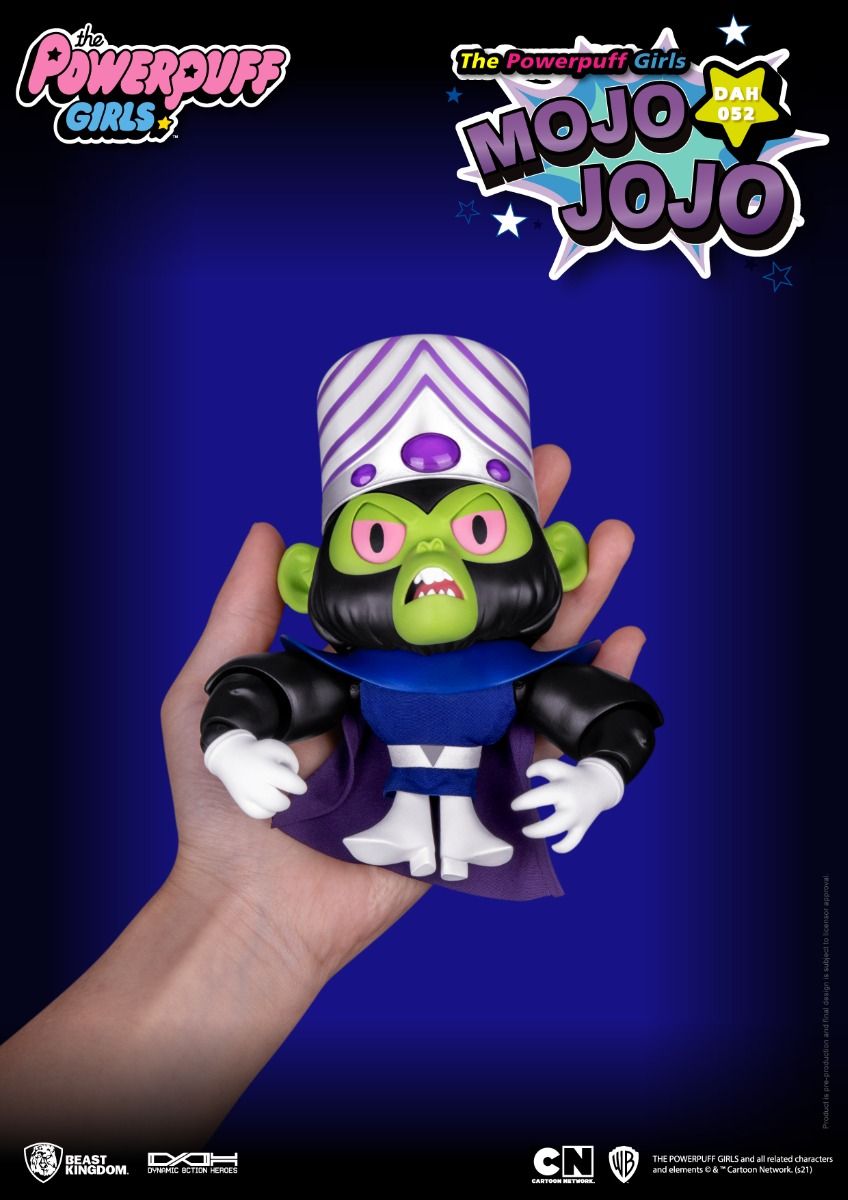 A detailed Powerpuff Girls Mojo Jojo action figure, green-faced with purple headpiece and cape, held in a hand