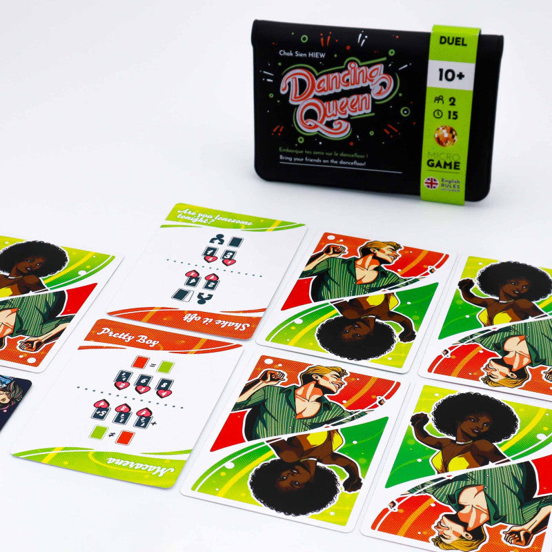 A "Dancing Queen" card game with its black case and colorful cards featuring illustrated dancers and game symbols