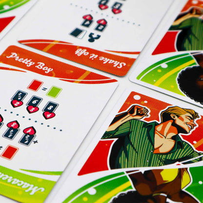 Colorful game cards showing a stylized dancing man, rules for "Shake it off", and other game elements