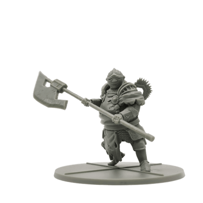 Grey unpainted miniature of a bulky armored warrior holding a large axe