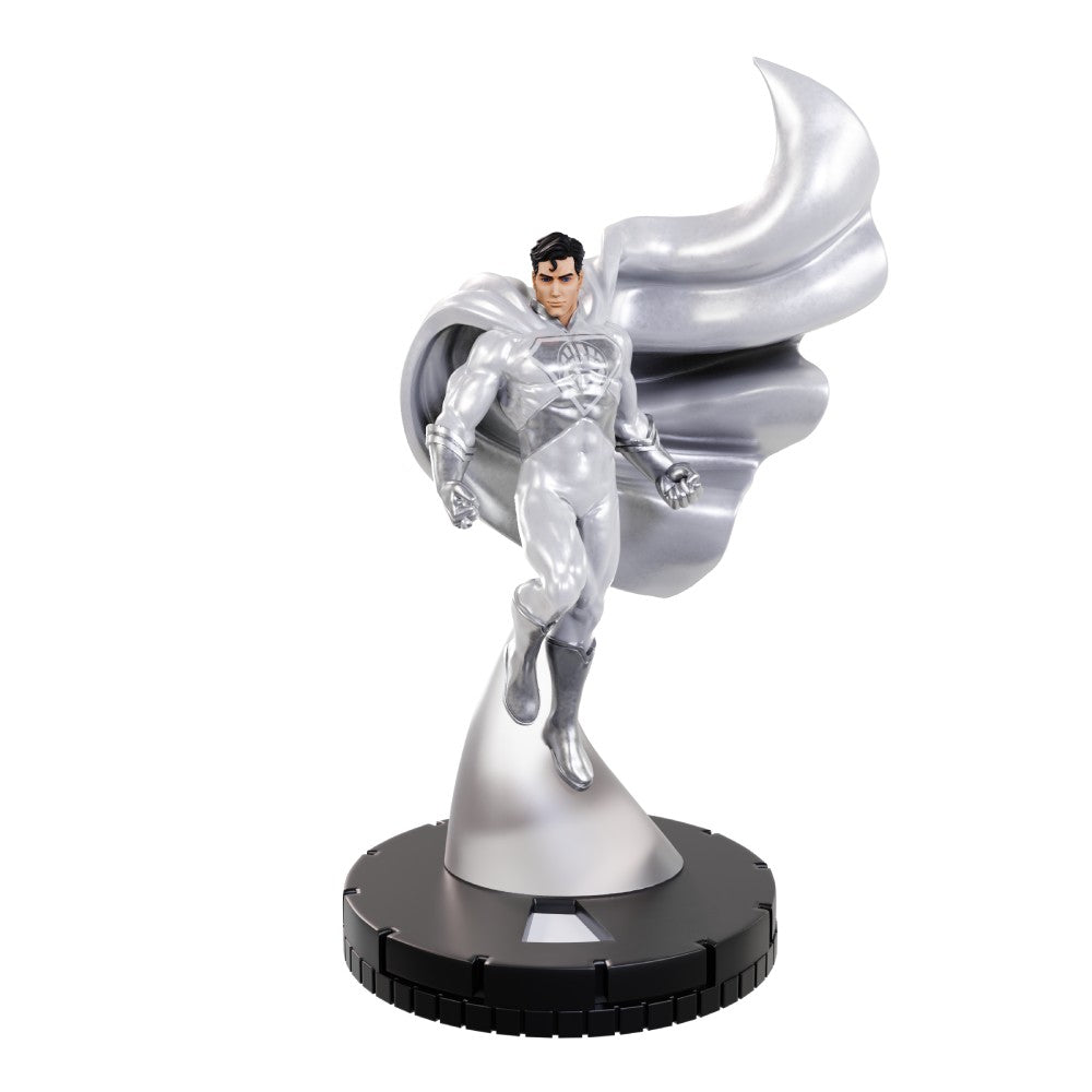 Silver Superman figure in flight, with a flowing cape and black hair, on a black circular base.