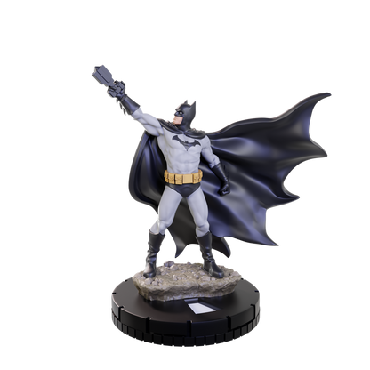 A DC HeroClix Starter Set 2024 Batman figure in a gray suit, black cape, and yellow utility belt holds a grappling hook on a rocky base and black stand