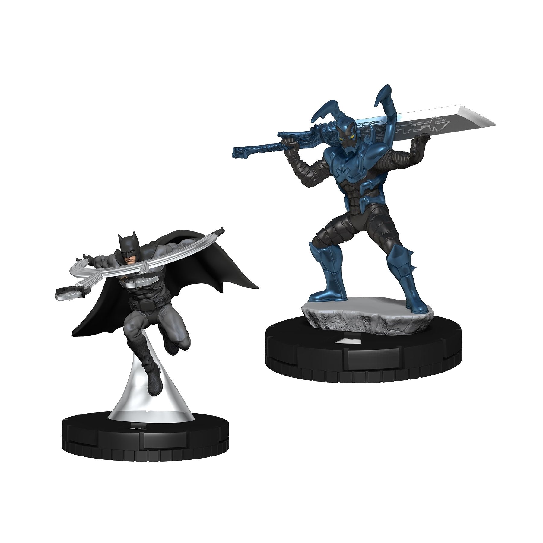 Collectible miniatures of Batman lunging with batarangs, and Blue Beetle in blue armor holding a massive sword.