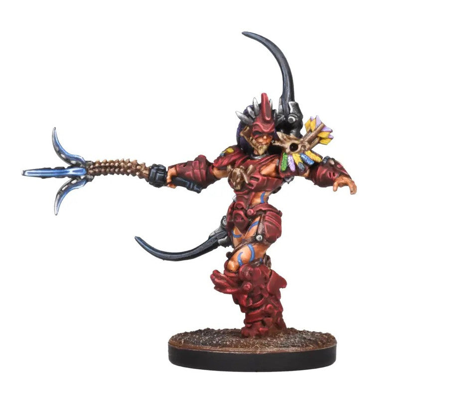 Red-armored female fantasy warrior miniature with a horned helmet, skull, and feathers, extending a glowing blue-tipped spear