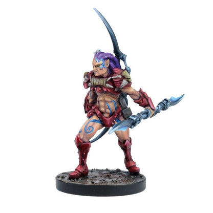 A miniature warrior with purple hair, red armor, and blue tattoos, holding a glowing double-bladed staff