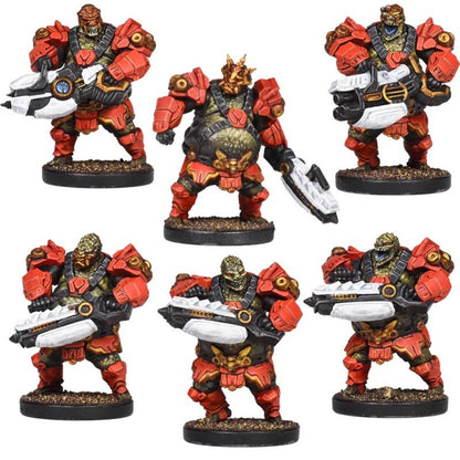 Six miniature alien warriors in red and black armor, armed with futuristic weapons, standing on bases