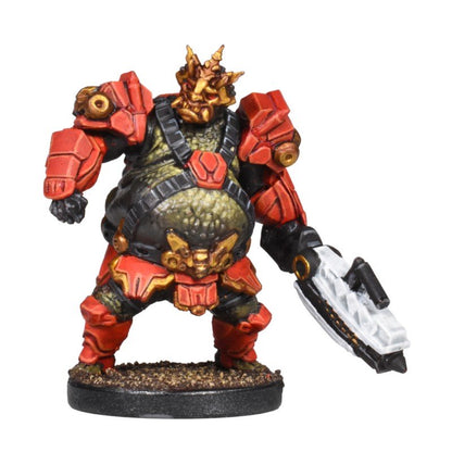 Miniature: a bulky, green-skinned alien in red armor with a spiky gold head, holding a white blaster