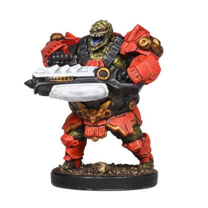Green reptilian alien miniature in heavy red armor, armed with a large futuristic rifle