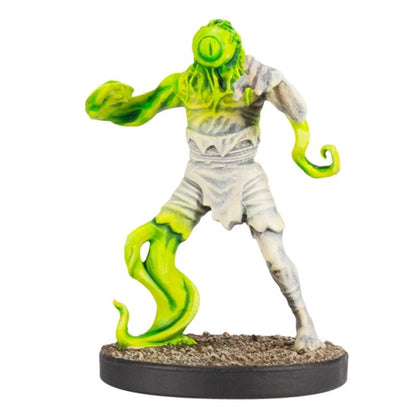 Monster miniature: half bright green with a single eye and tentacle leg; half pale, bandaged, reaching
