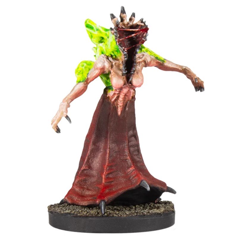 Horror miniature: A pale monster with a split head, glowing green back, red skirt, and outstretched clawed arms
