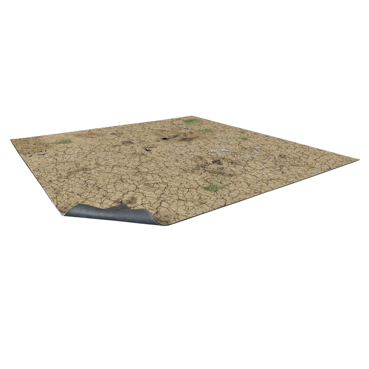 A desert terrain mat with cracked earth, rocks, and green tufts. One corner curls to show a dark underside.