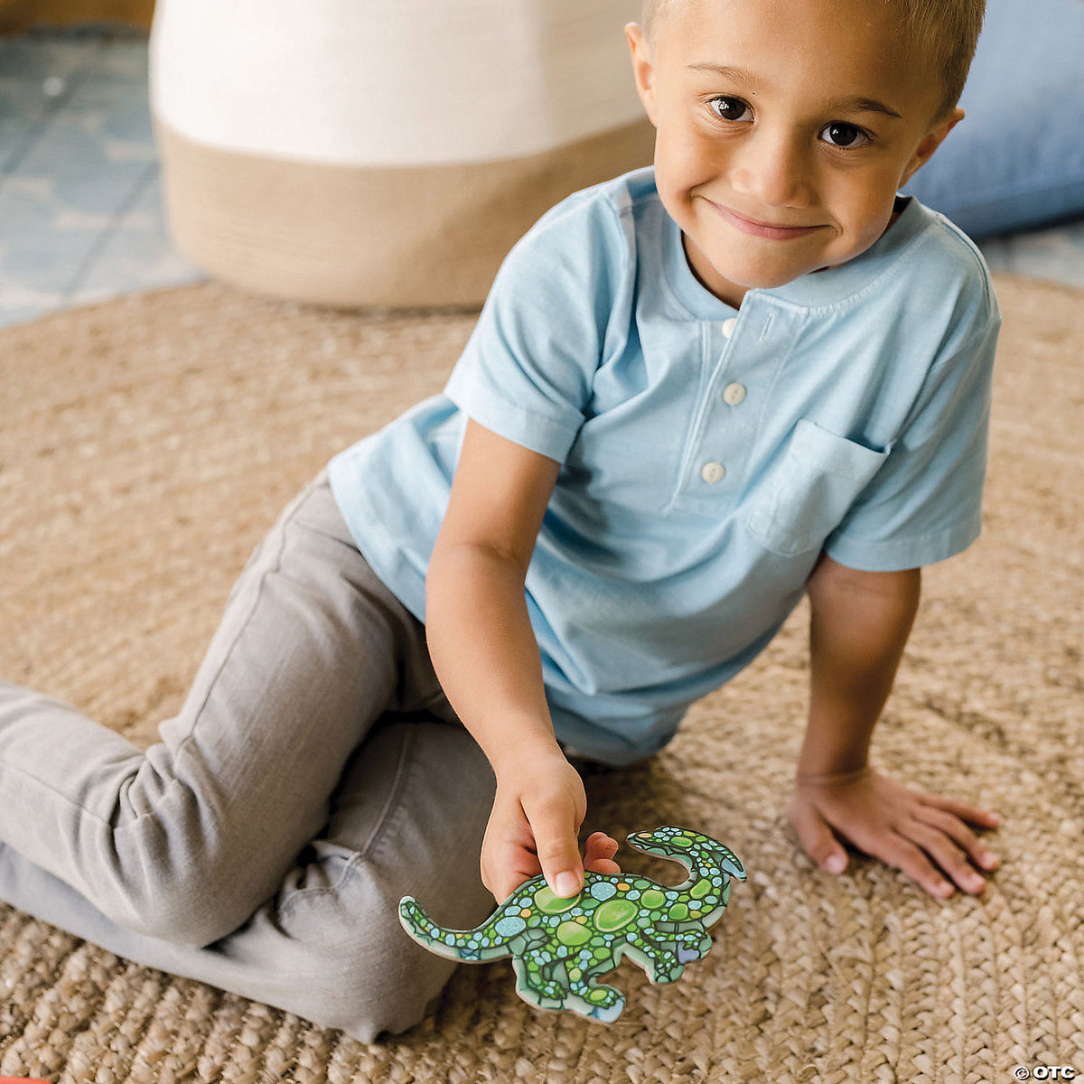 Child assembling the Dinosaur floor puzzle on the floor
