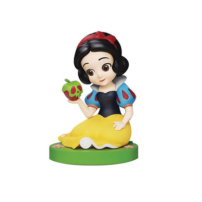 Miniature figurine of Snow White holding a red and green poison apple wearing a blue and yellow dress sitting on a green base