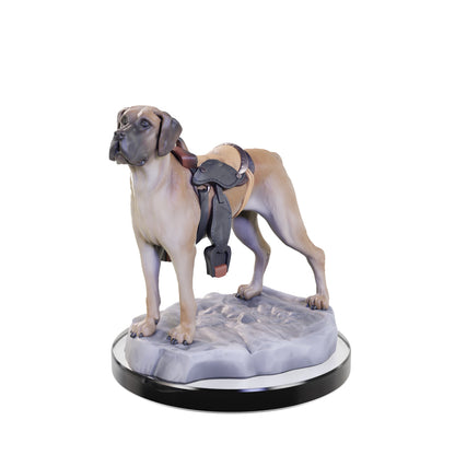 Ceramic fawn dog figurine wearing a saddle, standing on a rocky base