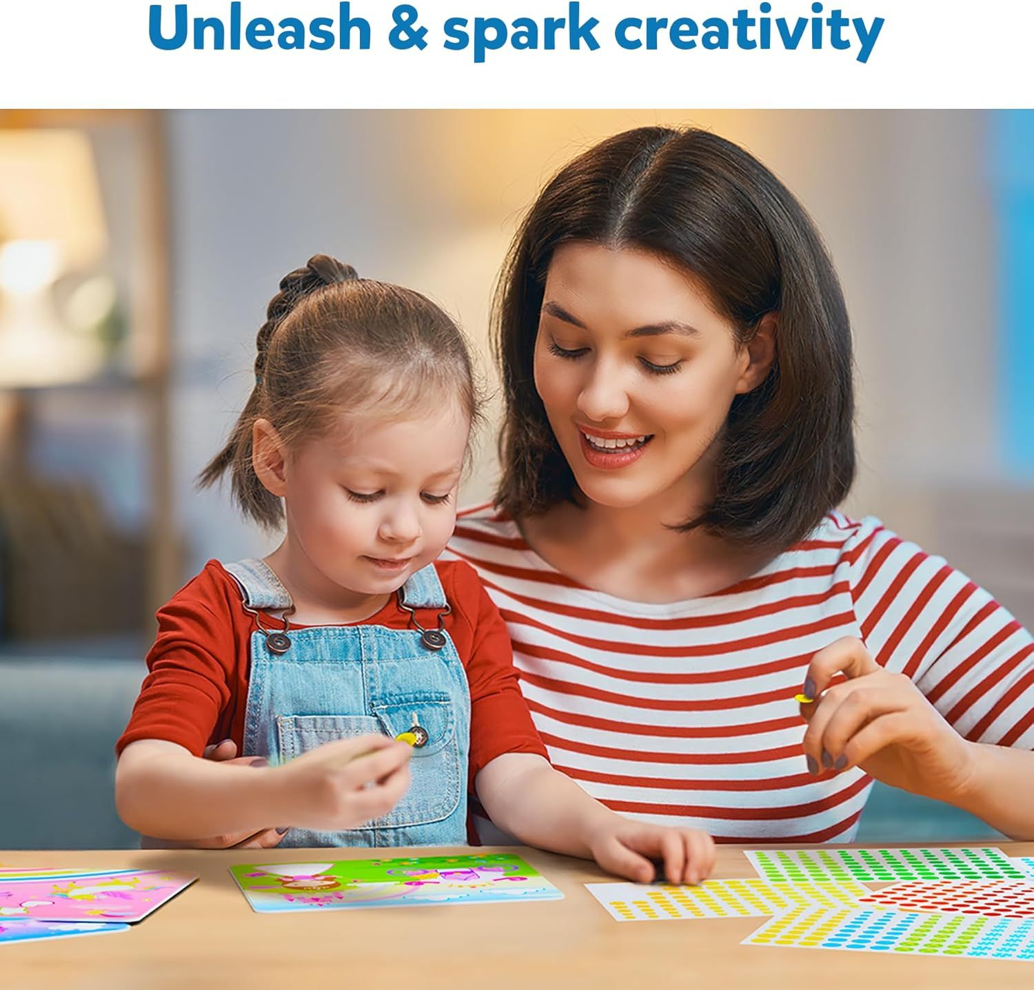 Woman and young girl doing a colorful sticker craft activity together
