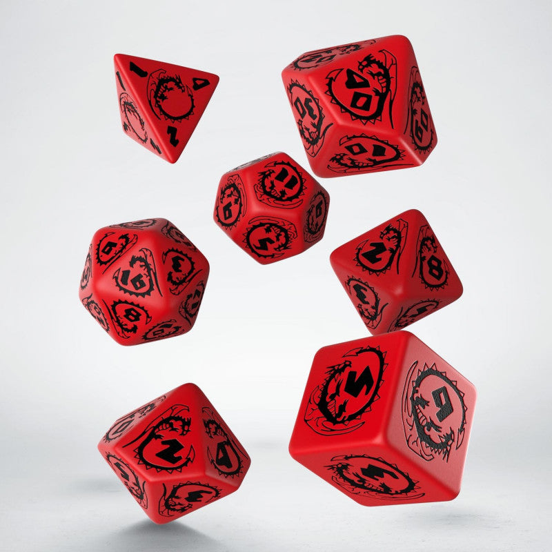 A set of seven red polyhedral RPG dice with black numbers and dragon designs, appearing to float