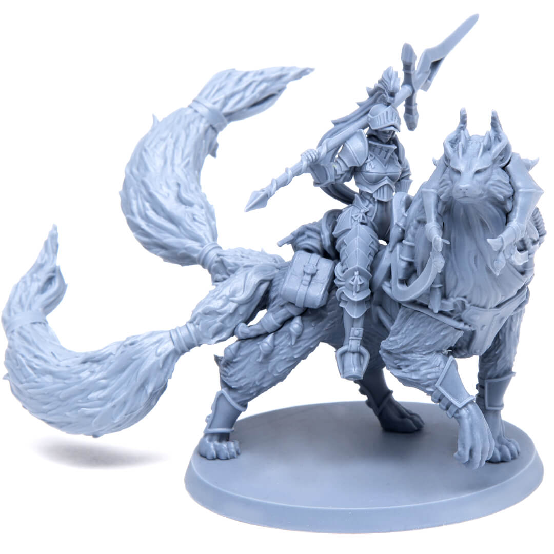 Unpainted grey miniature of an armored knight with a spear riding a large, armored wolf