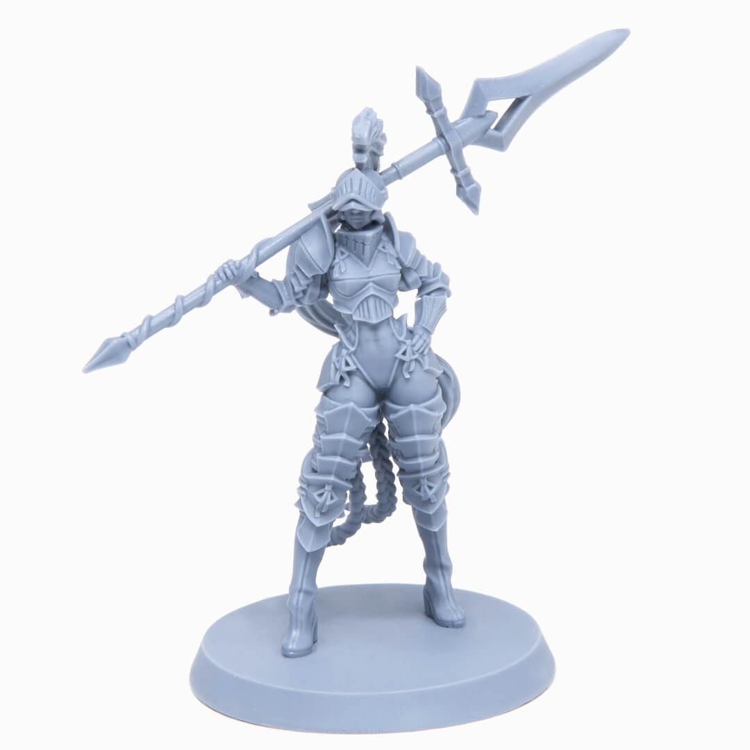 Unpainted grey miniature of an armored female warrior holding a polearm across her shoulders