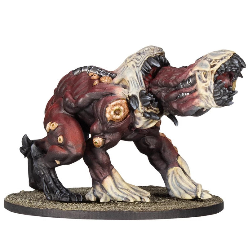 Red, fleshy monster miniature hunched forward, with two gaping, toothy mouths and bony growths on its body, on a base