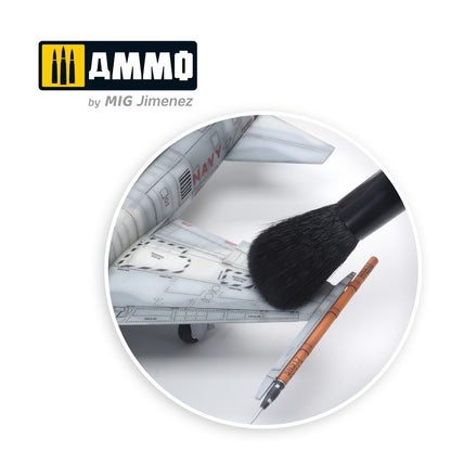 A large brush applying weathering to the wing of a gray F-4 Phantom model, a weathering pen is nearby and Ammo logo