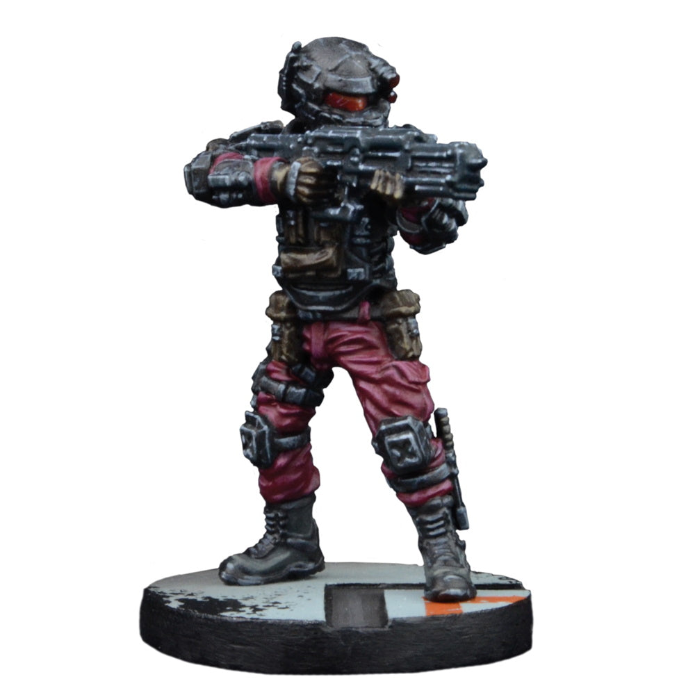Painted miniature of a sci-fi soldier in black armor, red pants & red visor, holding a large rifle