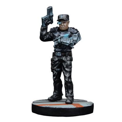 Miniature of a futuristic male tactical figure in dark armor with glowing tech, wearing an eyepiece visor and raising a pistol