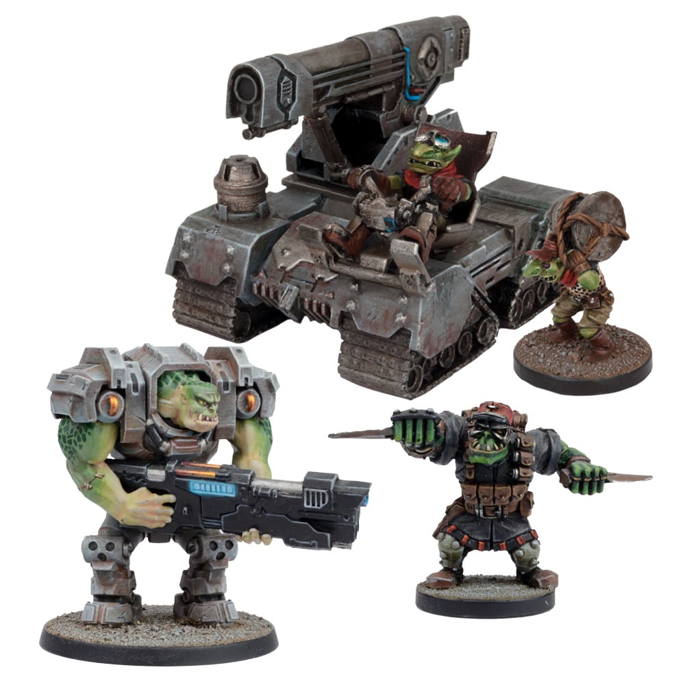 Miniature green-skinned figures: an armored tank, a large Ork with a rifle, a knife-wielding Ork, and a Grot with a drum
