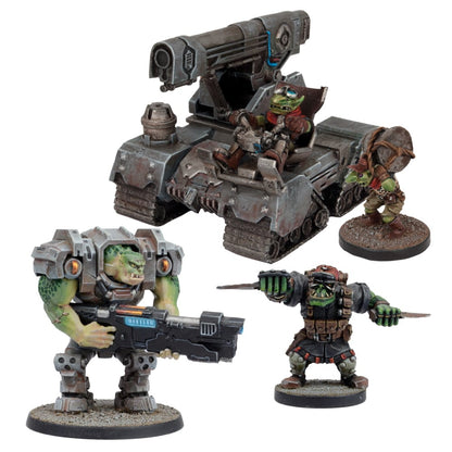 Miniature green-skinned figures: an armored tank, a large Ork with a rifle, a knife-wielding Ork, and a Grot with a drum