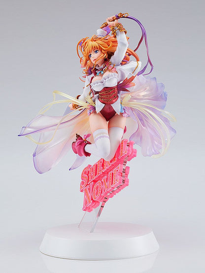 Side view highlighting Sheryl Nome’s flowing dress and confident pose