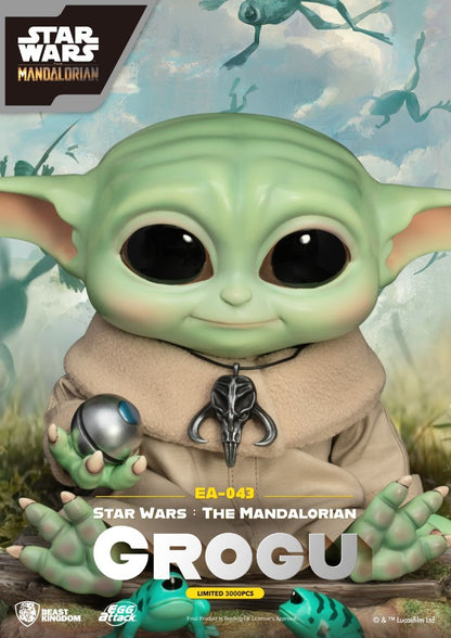 Grogu Egg Attack Action Figure from Star Wars The Mandalorian holding metal ball and wearing Mandalore pendant